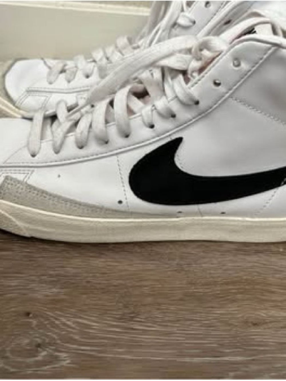 Nike White High-Top Sneakers with Black Swoosh Accent